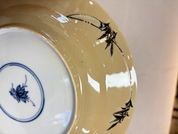 A pair of Chinese famille verte caf&eacute;-au-lait-ground plates with floral design, lotus mark, Kangxi