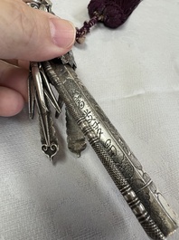 A fine Chinese silver pendant with inscriptions on a plexiglas stand, 19th C.