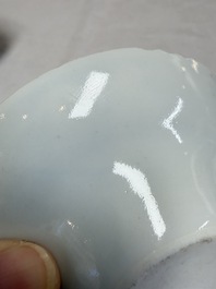 A pair of Chinese inscribed blue and white 'Clouds' tea bowls, covers and stands, Guangxu mark and of the period