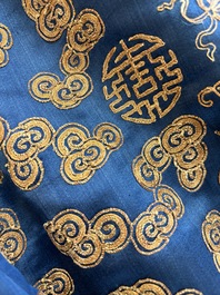 A Chinese embroidered silk blue-ground 'Dragons' robe, adapted into a lady's dress, 19th C. and later