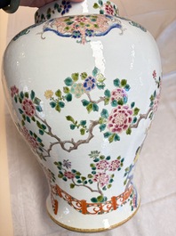 A pair of Chinese famille rose 'Phoenixes among Flowering Branches' vases and covers, 20th C.