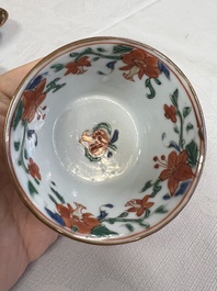 A Chinese famille rose capucine-ground covered teapot with floral design, seven cups and saucers, Yongzheng/Qianlong