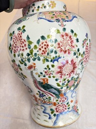 A pair of Chinese famille rose 'Phoenixes among Flowering Branches' vases and covers, 20th C.