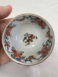 A Chinese famille rose capucine-ground covered teapot with floral design, seven cups and saucers, Yongzheng/Qianlong