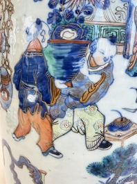 A Chinese doucai and famille rose rouleau vase with figures among antiquities, 19th C.