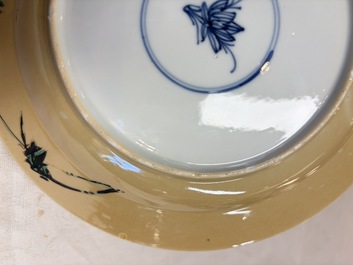 A pair of Chinese famille verte caf&eacute;-au-lait-ground plates with floral design, lotus mark, Kangxi