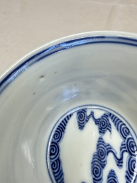 A pair of Chinese inscribed blue and white 'Clouds' tea bowls, covers and stands, Guangxu mark and of the period