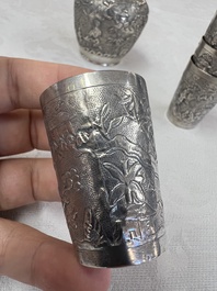 A Chinese Canton or Vietnamese silver bottle vase with landscape design and six cups, 19th C.