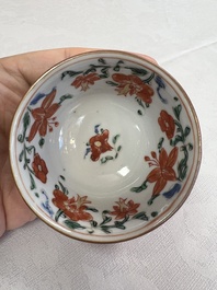 A Chinese famille rose capucine-ground covered teapot with floral design, seven cups and saucers, Yongzheng/Qianlong