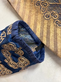 A Chinese embroidered silk blue-ground 'Dragons' robe, adapted into a lady's dress, 19th C. and later