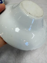 A pair of Chinese inscribed blue and white 'Clouds' tea bowls, covers and stands, Guangxu mark and of the period