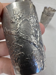 A Chinese Canton or Vietnamese silver bottle vase with landscape design and six cups, 19th C.