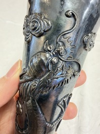 A Chinese silver 'Dragon' vase, two stem cups and a handled cup, various marks, 19/20th C.