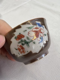 A Chinese famille rose capucine-ground covered teapot with floral design, seven cups and saucers, Yongzheng/Qianlong