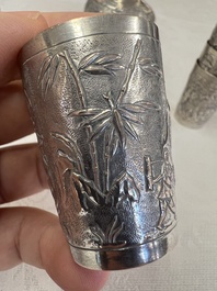 A Chinese Canton or Vietnamese silver bottle vase with landscape design and six cups, 19th C.