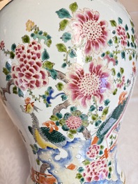 A pair of Chinese famille rose 'Phoenixes among Flowering Branches' vases and covers, 20th C.
