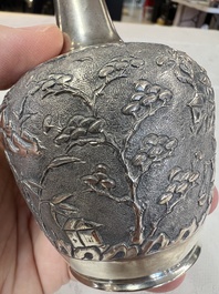 A Chinese Canton or Vietnamese silver bottle vase with landscape design and six cups, 19th C.
