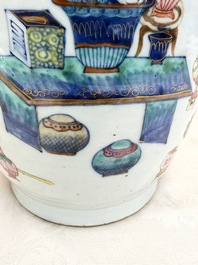 A Chinese doucai and famille rose rouleau vase with figures among antiquities, 19th C.