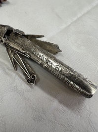 A fine Chinese silver pendant with inscriptions on a plexiglas stand, 19th C.