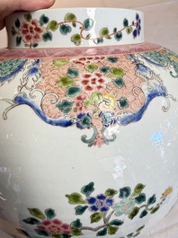 A pair of Chinese famille rose 'Phoenixes among Flowering Branches' vases and covers, 20th C.