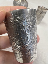 A Chinese Canton or Vietnamese silver bottle vase with landscape design and six cups, 19th C.