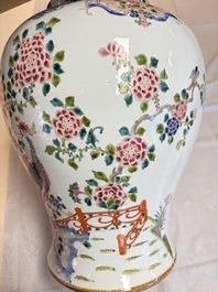 A pair of Chinese famille rose 'Phoenixes among Flowering Branches' vases and covers, 20th C.
