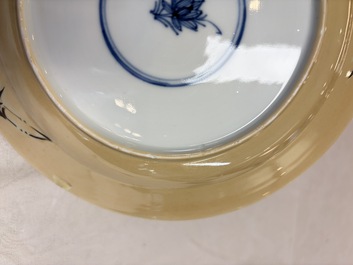 A pair of Chinese famille verte caf&eacute;-au-lait-ground plates with floral design, lotus mark, Kangxi