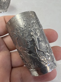 A Chinese Canton or Vietnamese silver bottle vase with landscape design and six cups, 19th C.
