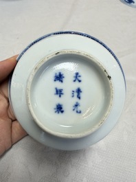 A pair of Chinese inscribed blue and white 'Clouds' tea bowls, covers and stands, Guangxu mark and of the period