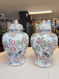 A pair of Chinese famille rose 'Phoenixes among Flowering Branches' vases and covers, 20th C.
