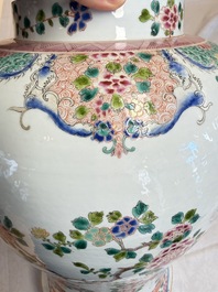 A pair of Chinese famille rose 'Phoenixes among Flowering Branches' vases and covers, 20th C.