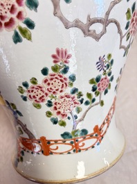 A pair of Chinese famille rose 'Phoenixes among Flowering Branches' vases and covers, 20th C.