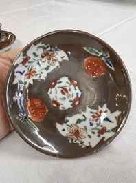 A Chinese famille rose capucine-ground covered teapot with floral design, seven cups and saucers, Yongzheng/Qianlong
