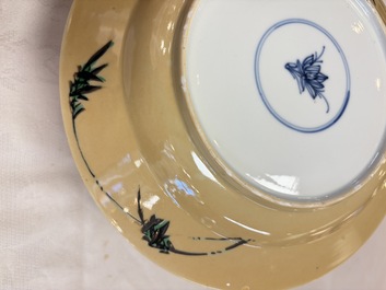 A pair of Chinese famille verte caf&eacute;-au-lait-ground plates with floral design, lotus mark, Kangxi