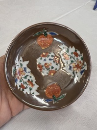 A Chinese famille rose capucine-ground covered teapot with floral design, seven cups and saucers, Yongzheng/Qianlong