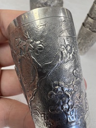 A Chinese Canton or Vietnamese silver bottle vase with landscape design and six cups, 19th C.