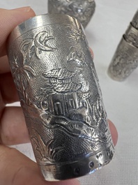 A Chinese Canton or Vietnamese silver bottle vase with landscape design and six cups, 19th C.