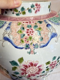 A pair of Chinese famille rose 'Phoenixes among Flowering Branches' vases and covers, 20th C.