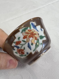 A Chinese famille rose capucine-ground covered teapot with floral design, seven cups and saucers, Yongzheng/Qianlong