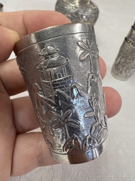 A Chinese Canton or Vietnamese silver bottle vase with landscape design and six cups, 19th C.