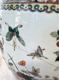A pair of Chinese famille verte 'Flowers and Butterflies' fishbowls, 19th C.