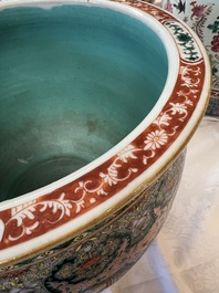 A Chinese famille verte pink-ground scroll pot with narrative design, 19th C.