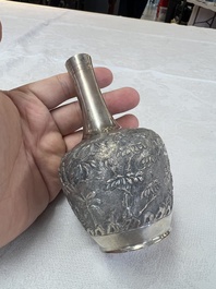 A Chinese Canton or Vietnamese silver bottle vase with landscape design and six cups, 19th C.