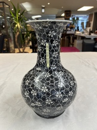 A rare Chinese famille noire 'Prunus on Cracked Ice' vase with 'Chilong' handles, 19th C.