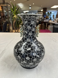 A rare Chinese famille noire 'Prunus on Cracked Ice' vase with 'Chilong' handles, 19th C.