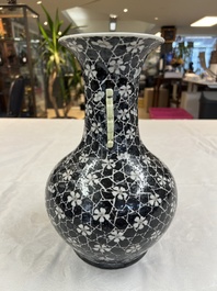 A rare Chinese famille noire 'Prunus on Cracked Ice' vase with 'Chilong' handles, 19th C.