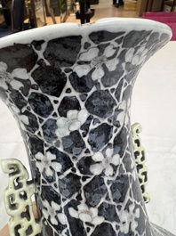 A rare Chinese famille noire 'Prunus on Cracked Ice' vase with 'Chilong' handles, 19th C.