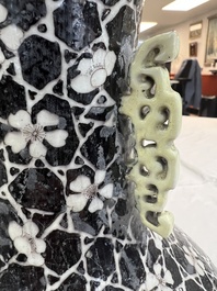 A rare Chinese famille noire 'Prunus on Cracked Ice' vase with 'Chilong' handles, 19th C.