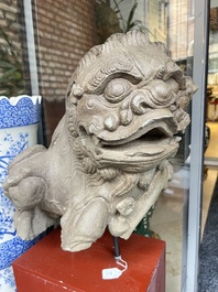 A pair of Chinese carved stone Buddhist lions on later red-lacquered wooden stands, Fujian, Qing
