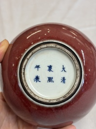 A Chinese copper-red-glazed plate, a meiping vase and two water pots, Kangxi marks, 19/20th C.